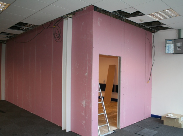 Fire rated acoustic partition being constructed